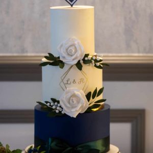 NAVY & CREAM WEDDING CAKE WITH ROSES